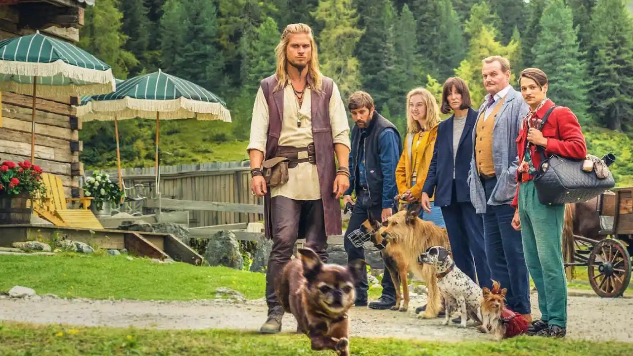 Comer, rezar, ladrar Grupo de tutores com seus cães em cena de Comer, Rezar, Ladrar, comédia sobre terapia, confusão e relações afetivas.