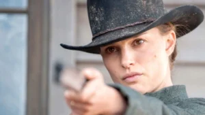 Em Busca da Justiça na HBO Max: Natalie Portman em faroeste de suspense que prende Natalie Portman em cena de Em Busca da Justiça, faroeste dramático disponível na HBO Max com clima de vingança e tensão no deserto.